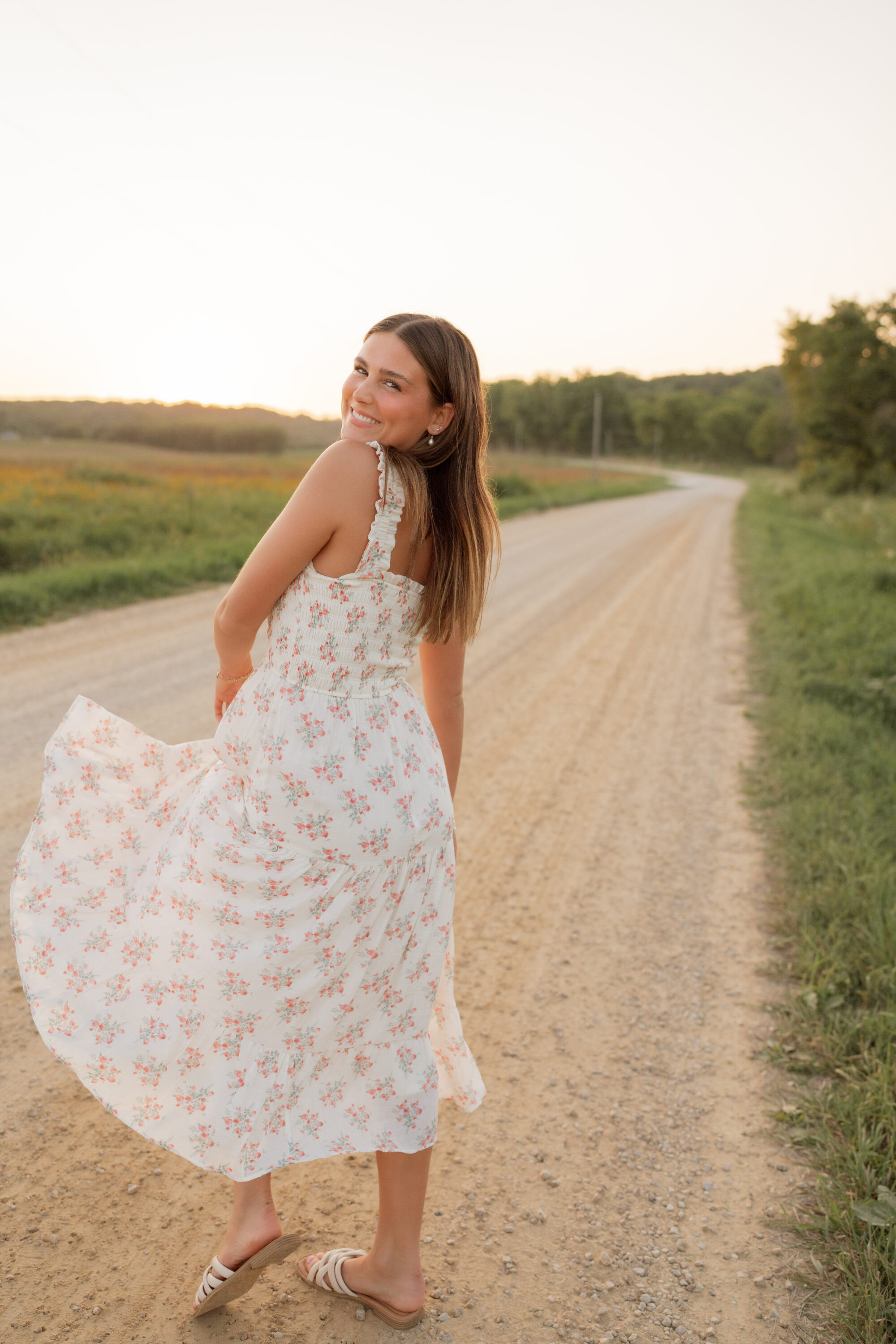 girl on a gravel road for her senior photos