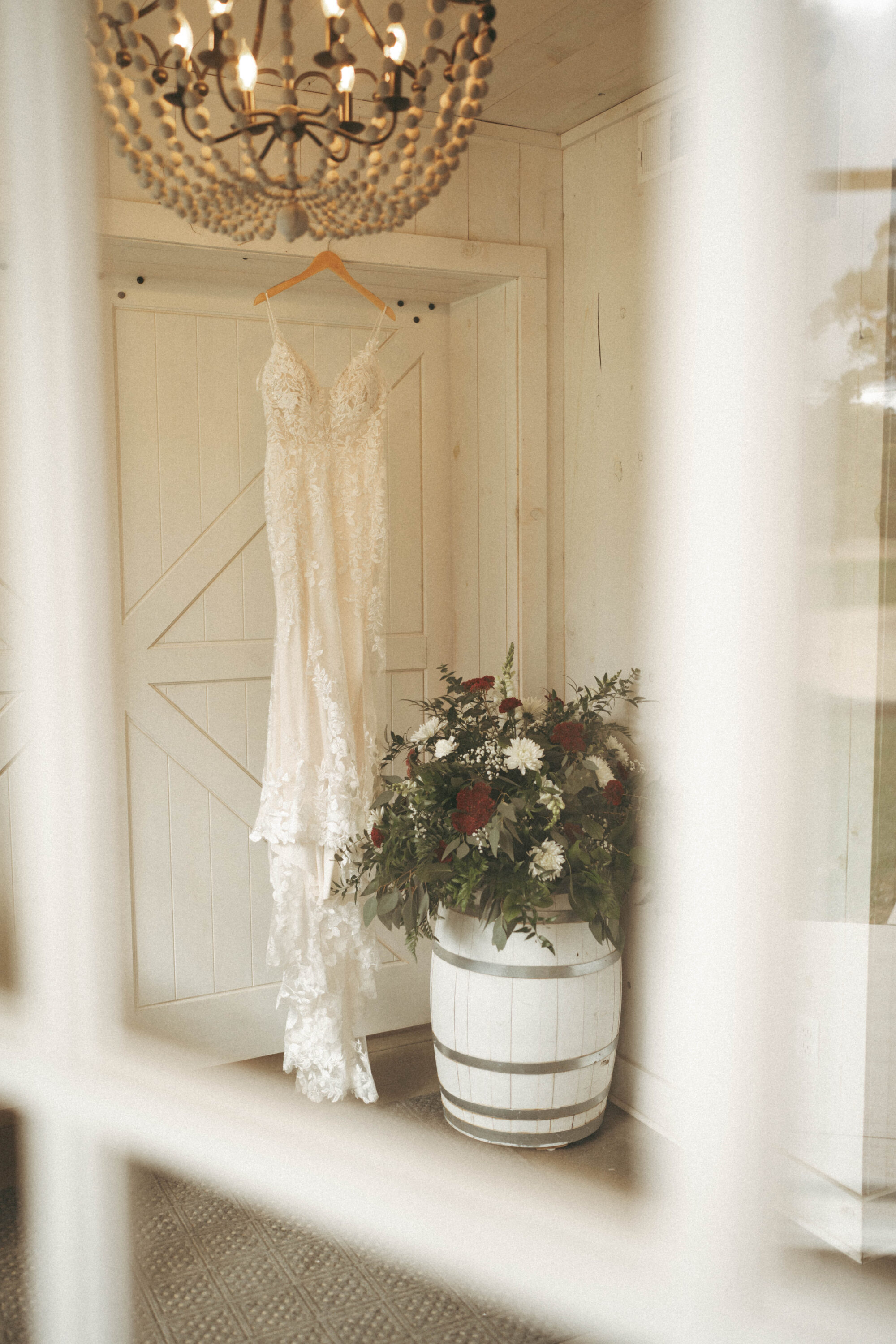 A wedding dress detail shot in the entry way at Willow Brooke Farm, in Red Wing, MN. 