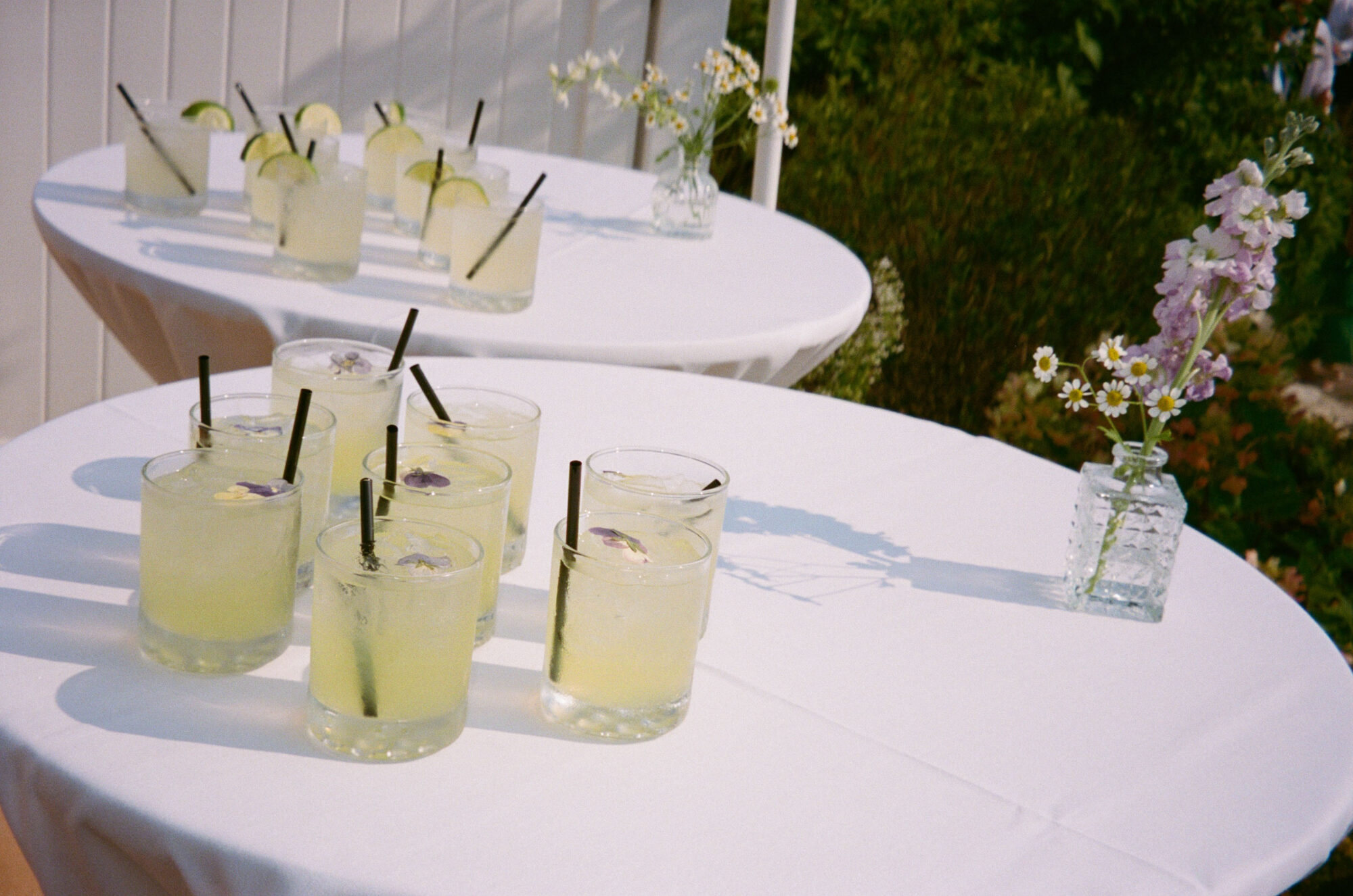 Wedding cocktails served at a Minnesota wedding, garnished with florals. 