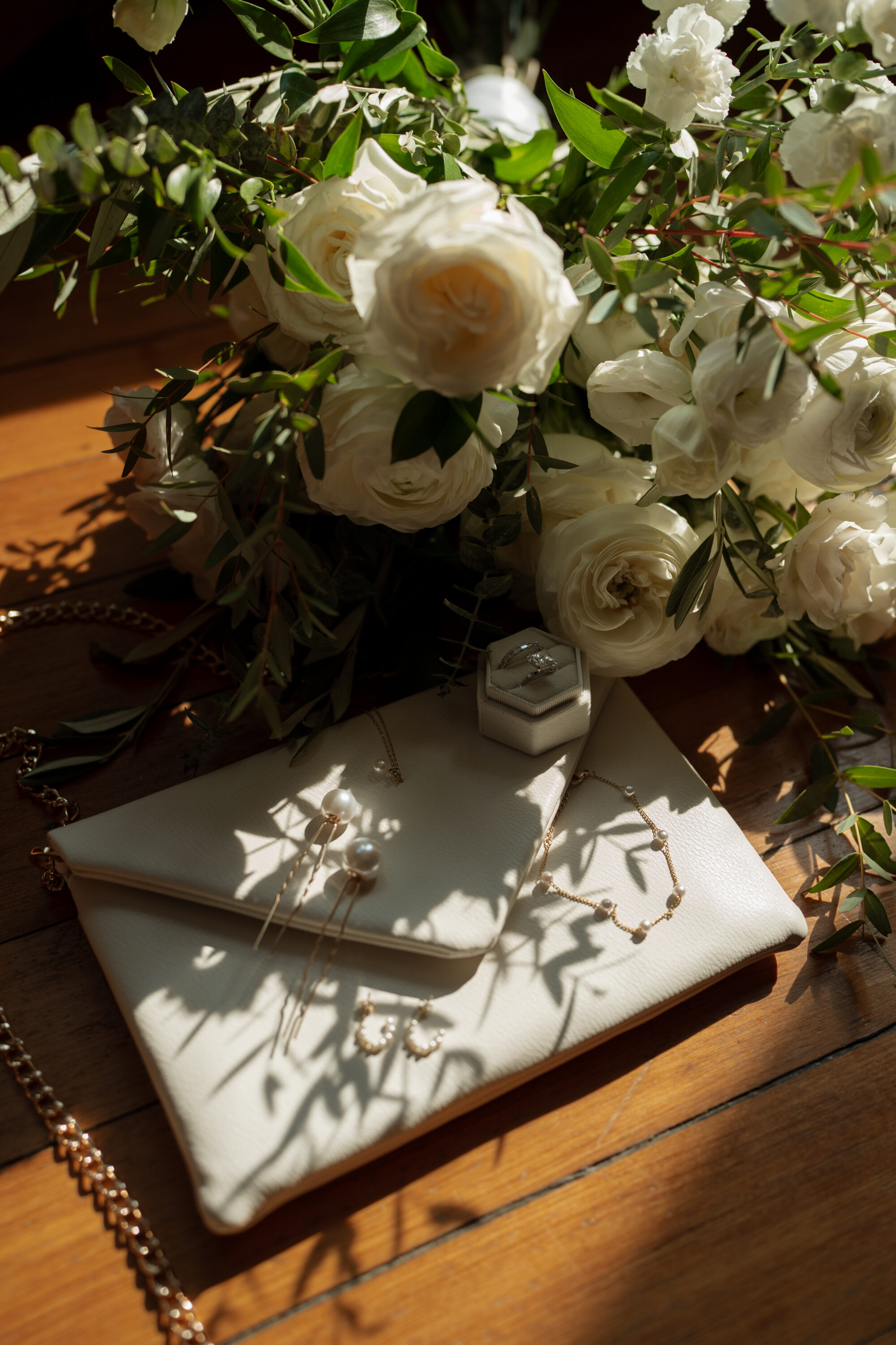 Detail shot of wedding bouquet and jewelry, and floral.