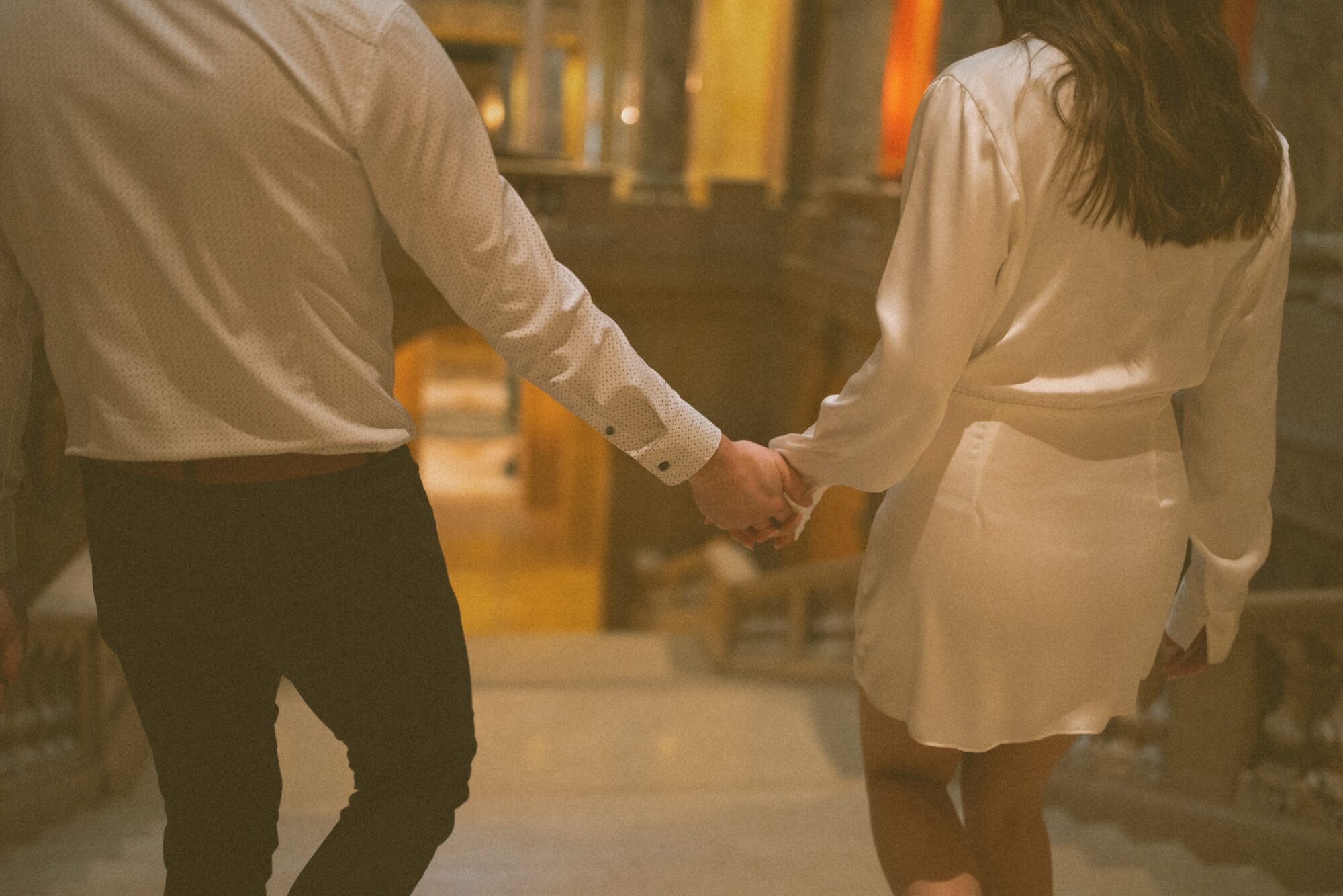 cinematic photo of couple holding hands