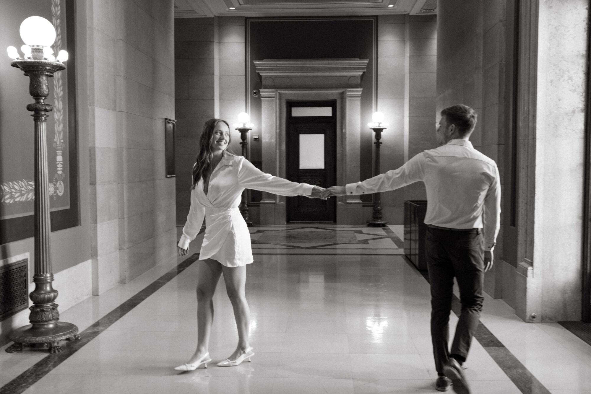 couple walking in state capitol building