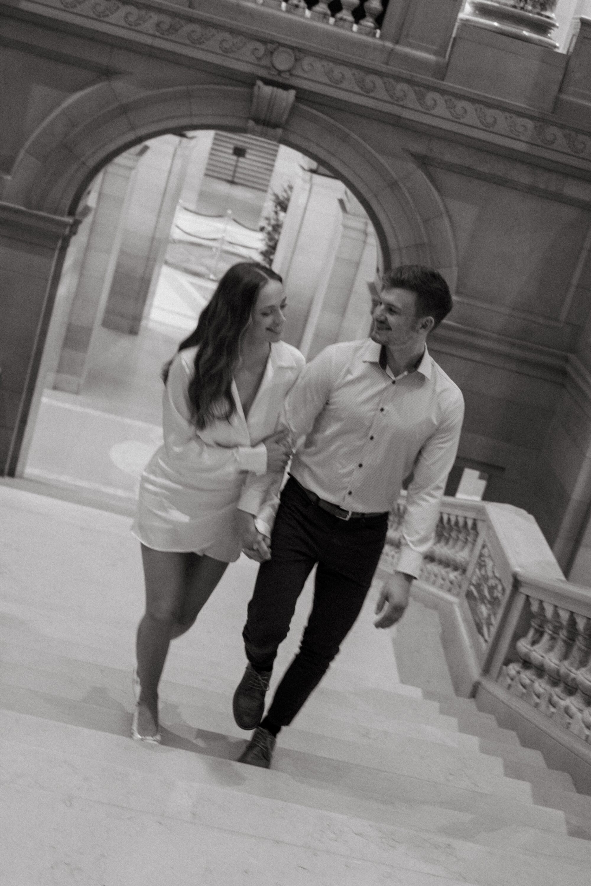 motion blur photo of engaged couple on stairs at minnesota state capitol building