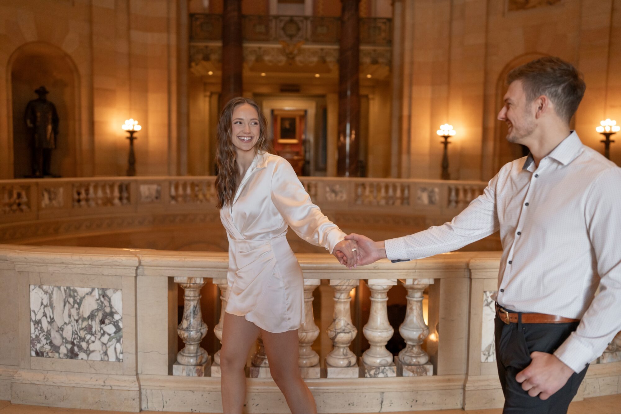 Couple walking in Minnesota state capitol buliding