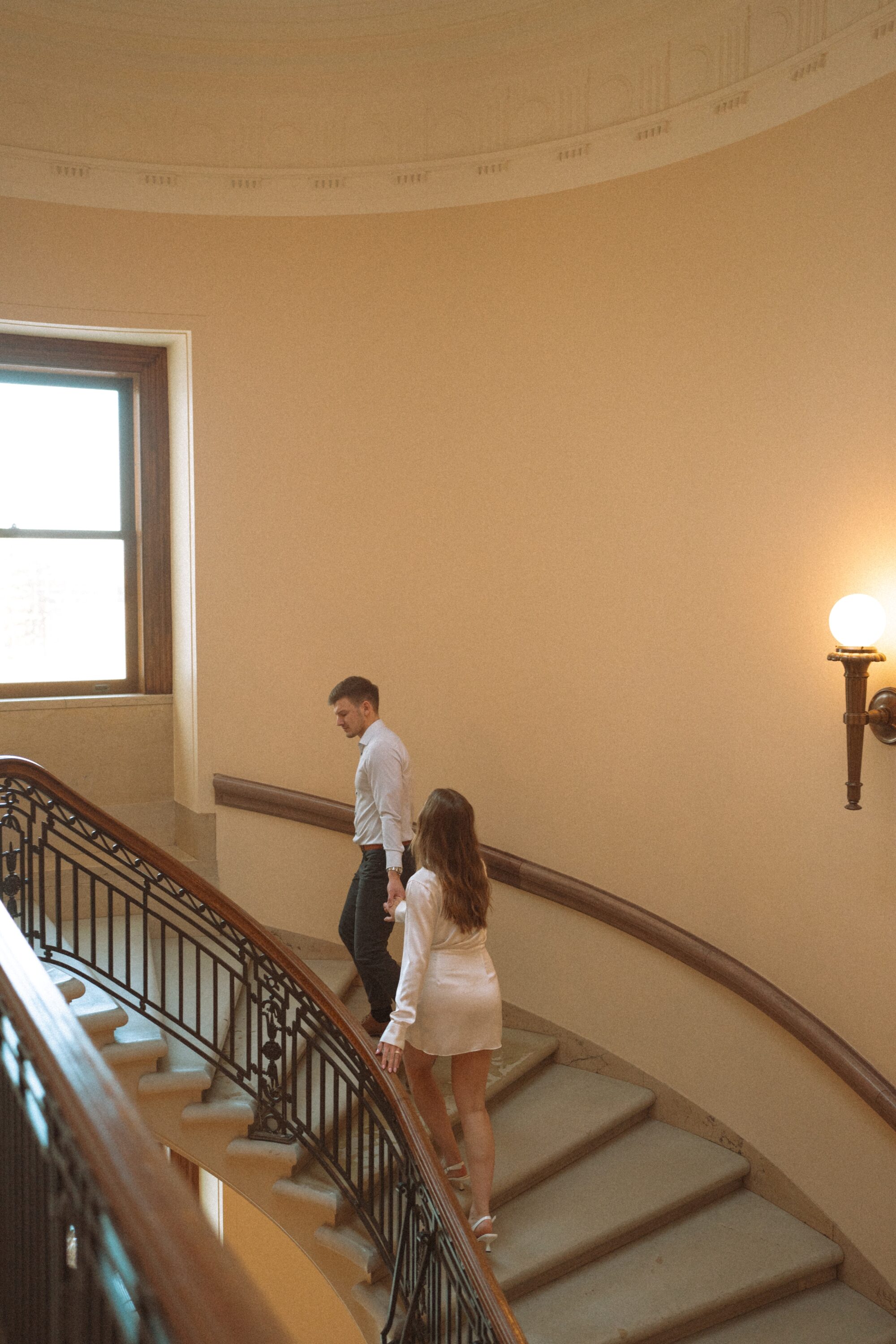 engaged couple on staircase in state capitol